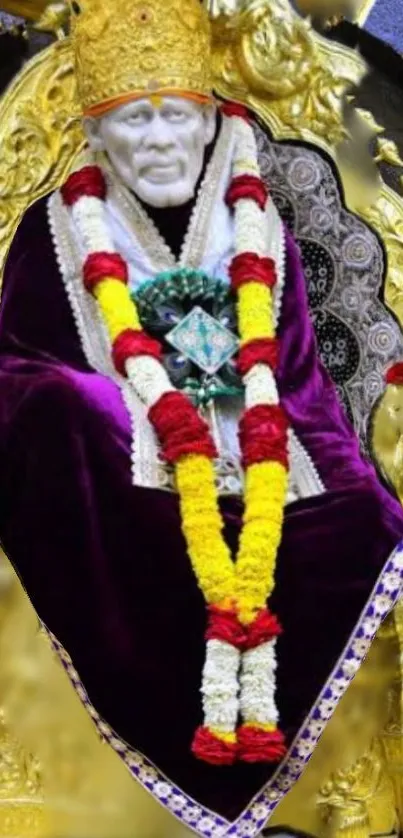 Sai Baba adorned in gold with vibrant garlands.