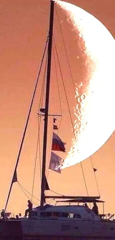 Sailboat illuminated by crescent moon at sunset.