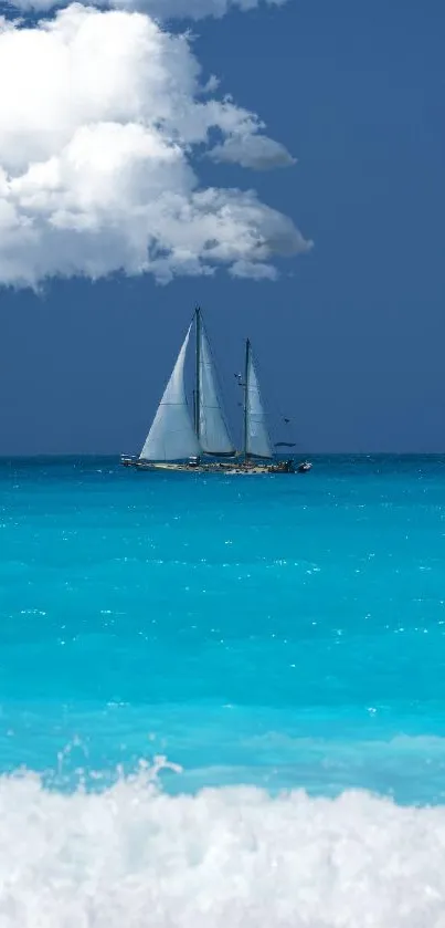 Sailboat sailing on a turquoise ocean beneath a blue sky with clouds.