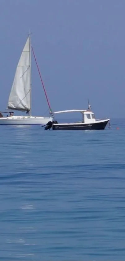 Sailboat on a calm blue sea with clear sky.