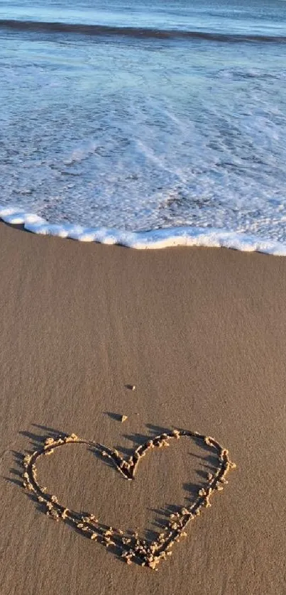 Heart drawn in sand with ocean backdrop, perfect beach wallpaper.