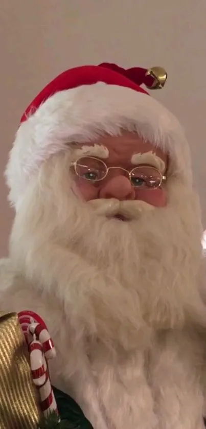 Santa Claus with gifts and candy cane in festive setup.