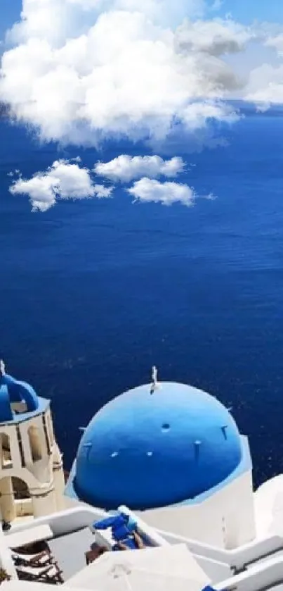 Santorini view with blue domes and ocean.