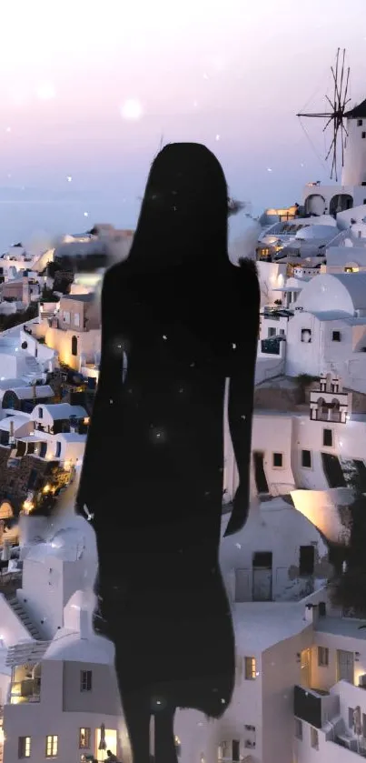 Silhouette overlooking Santorini architecture in evening light.