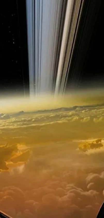 Saturn's rings and golden clouds in a space-themed mobile wallpaper.