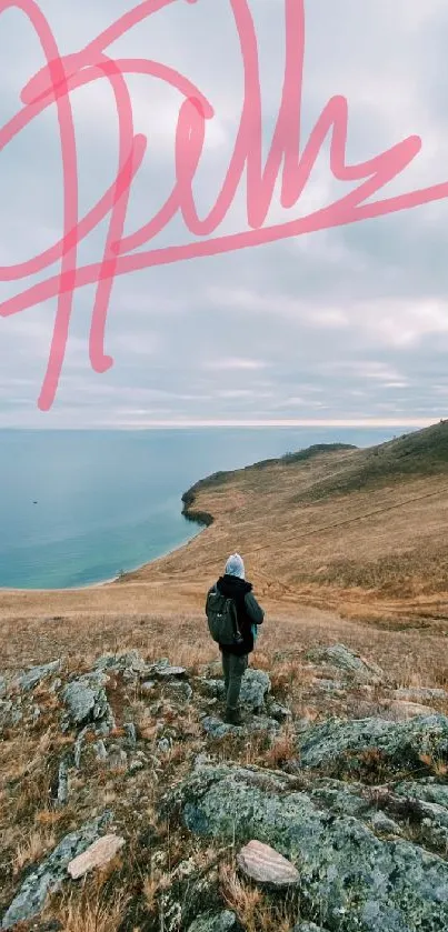 Traveler in scenic landscape by the coast with cloudy sky.