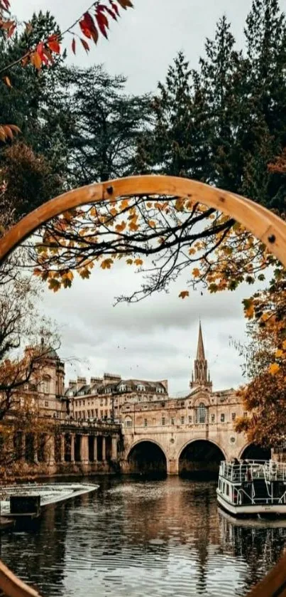 Autumn cityscape with bridge through circular frame.