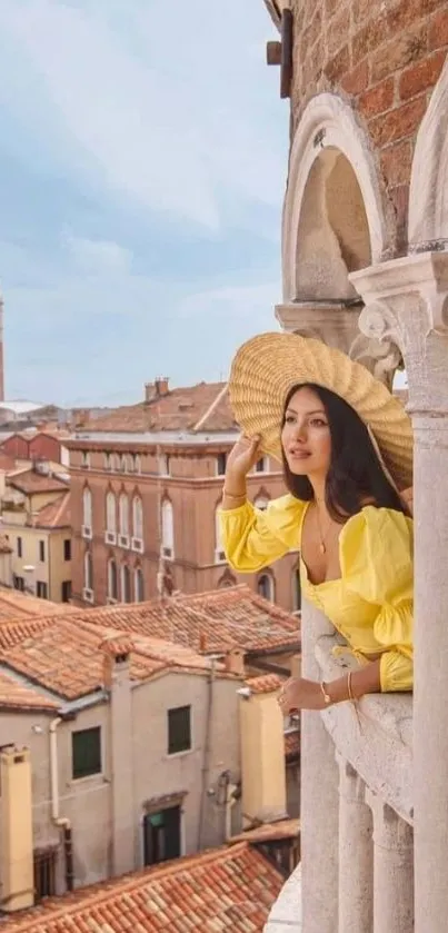 Woman on balcony overlooking historic city landscape with vibrant rooftops.