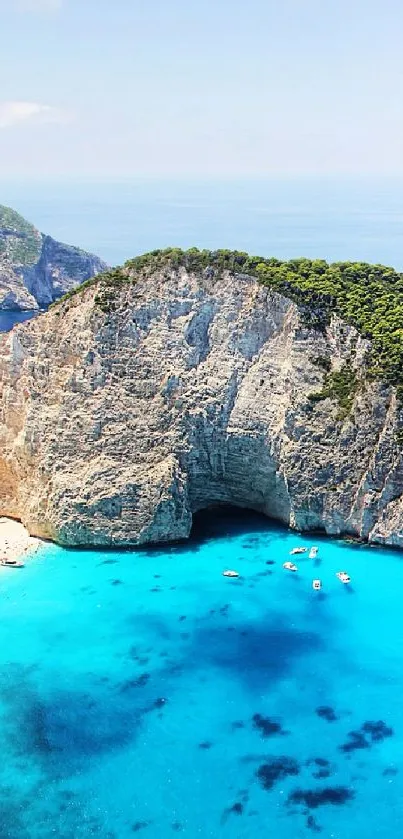 Breathtaking mobile wallpaper of a cliff by the stunning blue ocean with a clear sky.