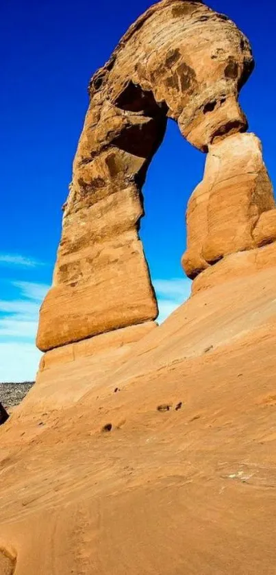 Desert rock formation against cobalt blue sky.