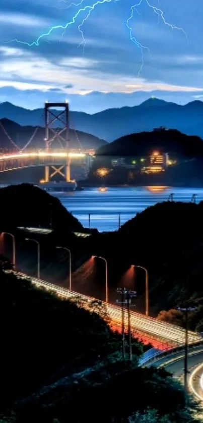 Nighttime bridge illuminated against a scenic sky.