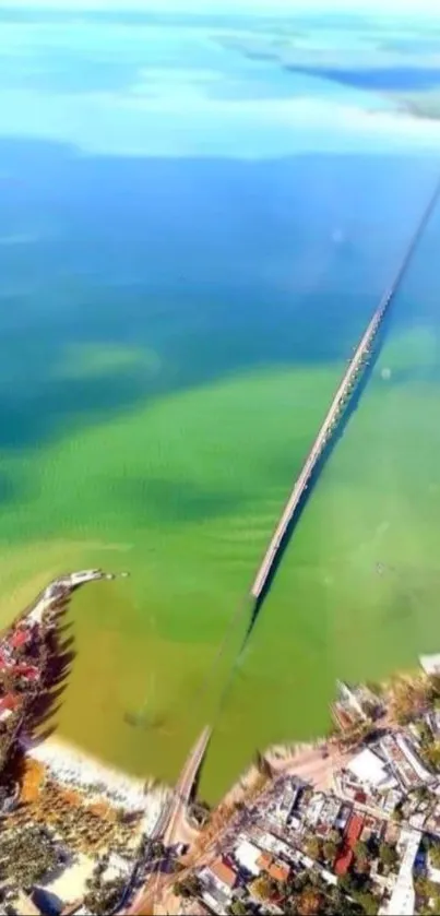 Aerial view of a long bridge spanning clear blue and green waters, ideal for wallpapers.