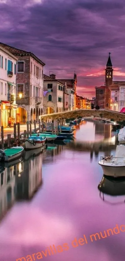 Scenic canal at sunset with vibrant reflections.