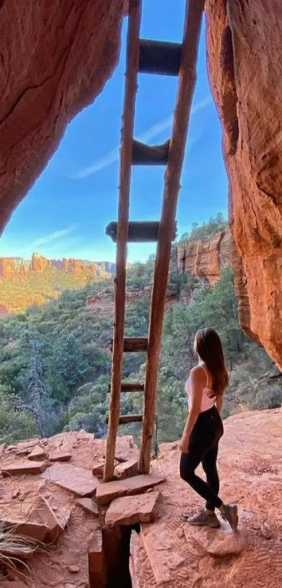 Woman exploring canyon with ladder view.