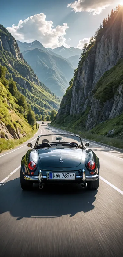 Classic convertible driving through scenic mountain pass.