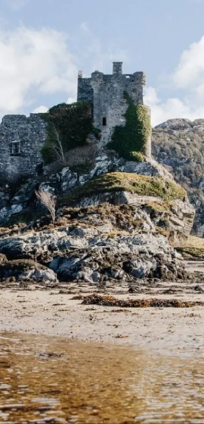 Scottish castle on a coastal landscape with blue sky.