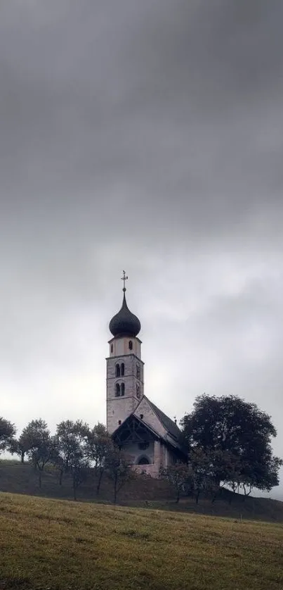 A serene church set against dramatic grey skies.