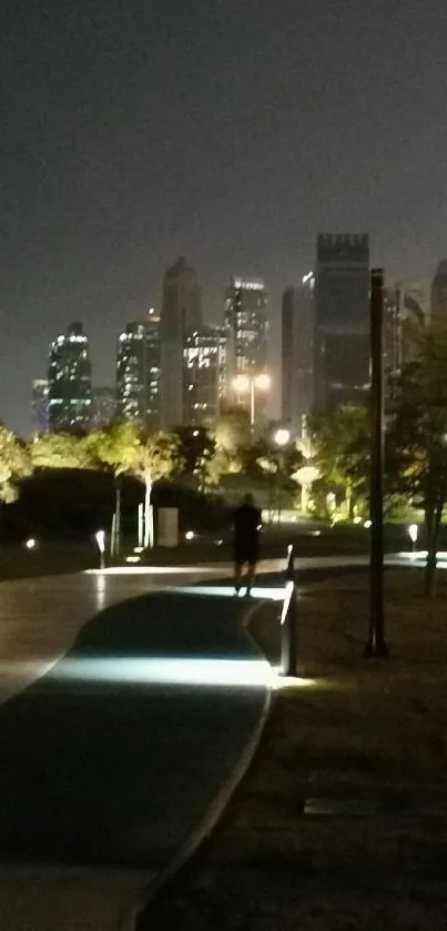 Night cityscape with skyscrapers and walkway in park.