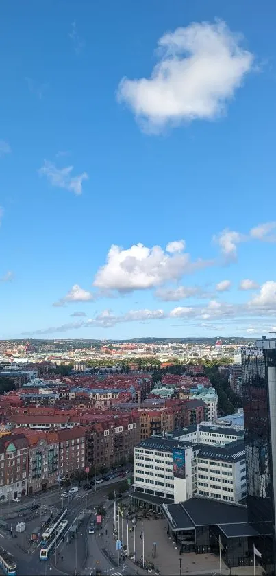 Aerial view of city skyline under vibrant blue sky.