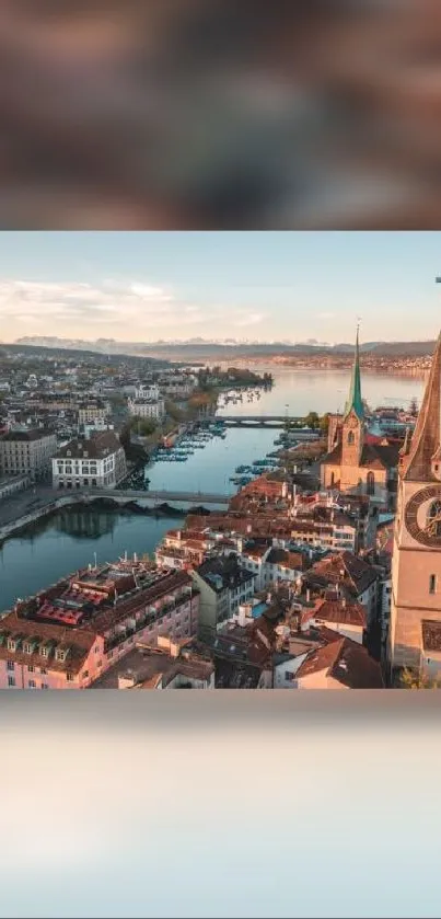 Aerial view of a European city with river and sunset sky.