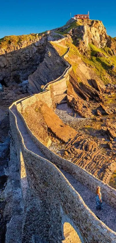 Scenic cliff pathway with rock formations and blue sky.