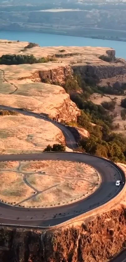 Aerial view of a winding road on stunning cliffs.