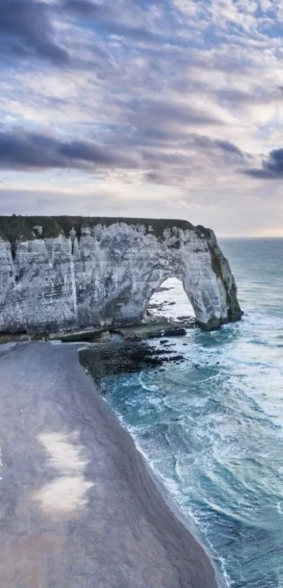 Scenic view of a cliffside beach with waves.