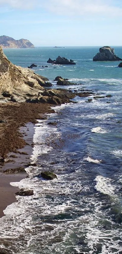 A scenic view of a coastal beach with cliffs and ocean waves.