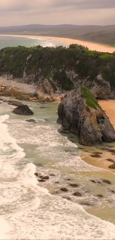 Scenic coastal landscape with cliffs and sandy beach at sunset.