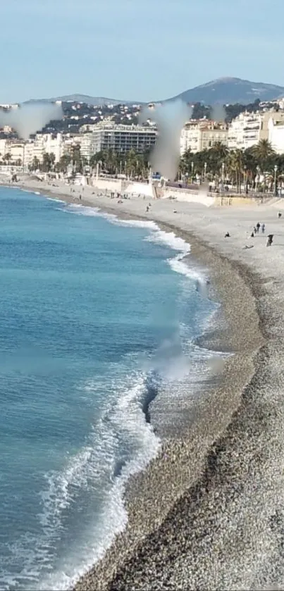 Serene coastal beach with blue ocean waves.