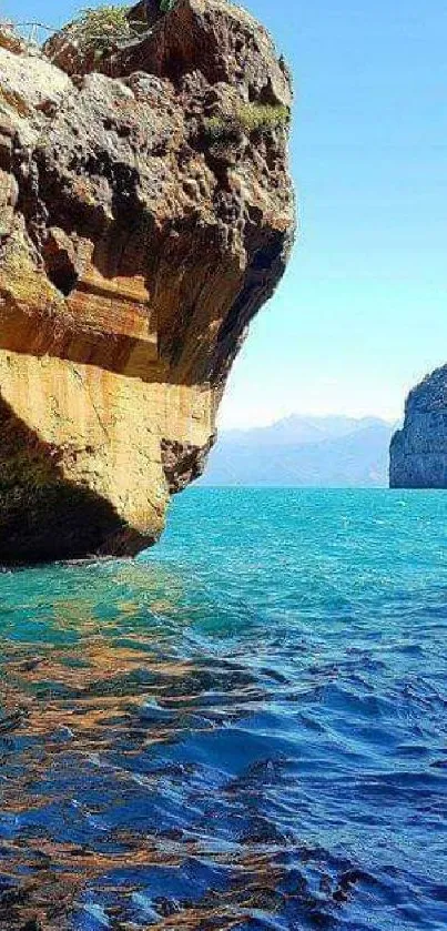 A breathtaking view from a coastal cave with blue sea and rocky cliffs.