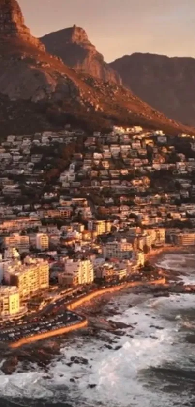 Sunlit coastal city with mountains at sunset.