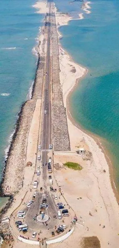 Aerial view of a scenic coastal highway lined with azure ocean and sandy beaches.