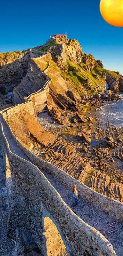 Moonlit pathway on rocky coastal landscape with vivid blue sky.