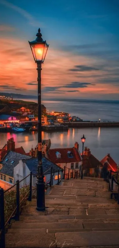 Coastal sunset view with a street lamp and a vibrant harbor.