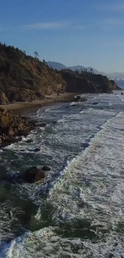 A breathtaking view of a rugged coastline with ocean waves and blue skies.