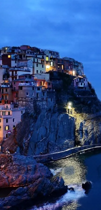 Scenic coastal village illuminated under a vibrant blue evening sky.