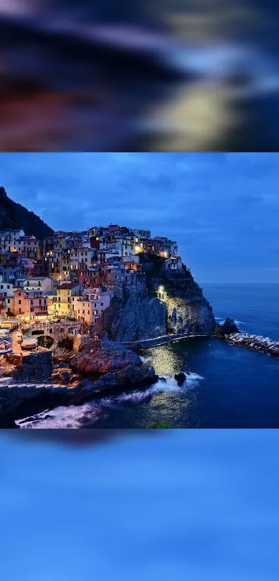 Twilight view of a coastal village with illuminated houses on the cliffs.