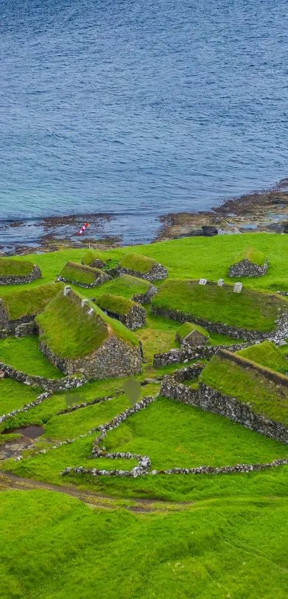 Scenic view of a green coastal village and ocean.