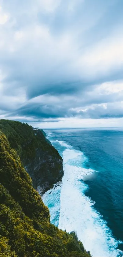 Scenic coastline with blue ocean and lush green cliffs under dramatic clouds.