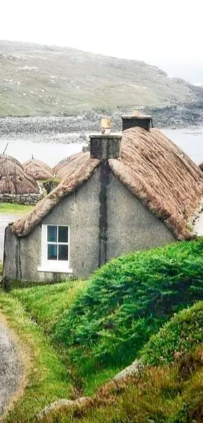 Serene countryside with thatched cottage and lush greenery.