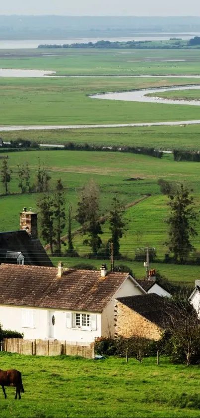 A peaceful countryside with green fields and a tranquil river.