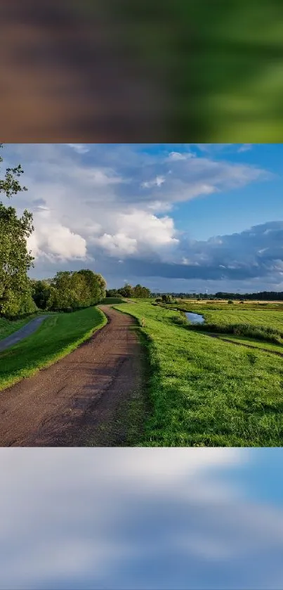 Lush green countryside path under a serene blue sky with clouds.