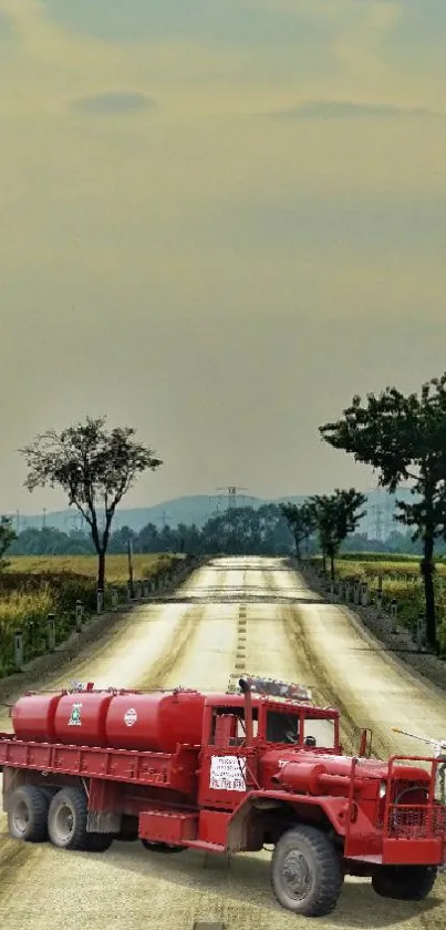 Scenic road with red truck under open sky wallpaper.