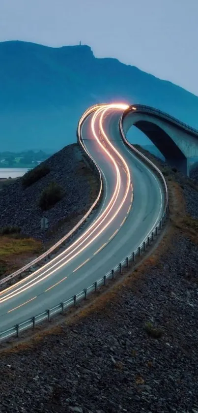 Curved road with mountain backdrop wallpaper for mobile.