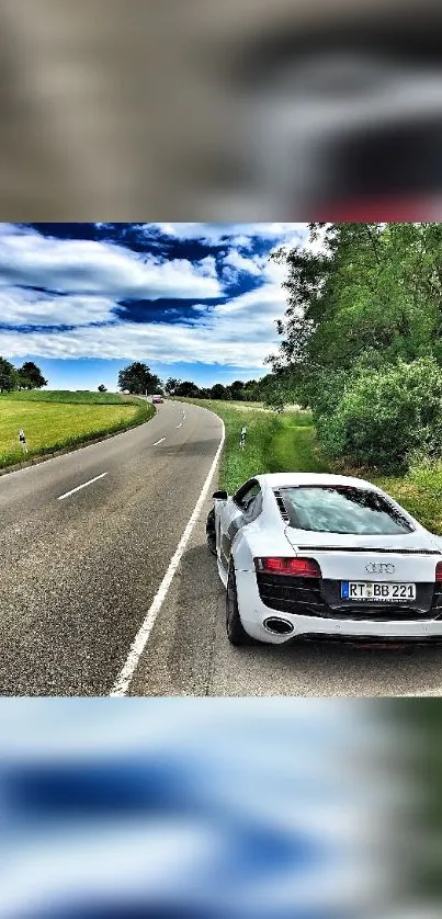 White sports car on a scenic country road.