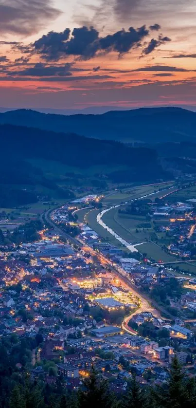 Evening cityscape with glowing lights and a colorful sunset over hills.