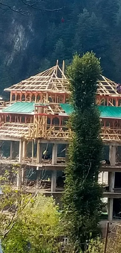 Building under construction in lush forest setting.