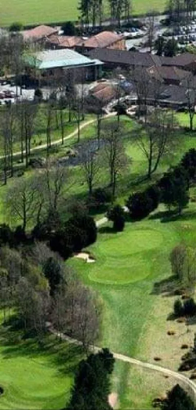 Aerial view of lush green golf course with clubhouse.