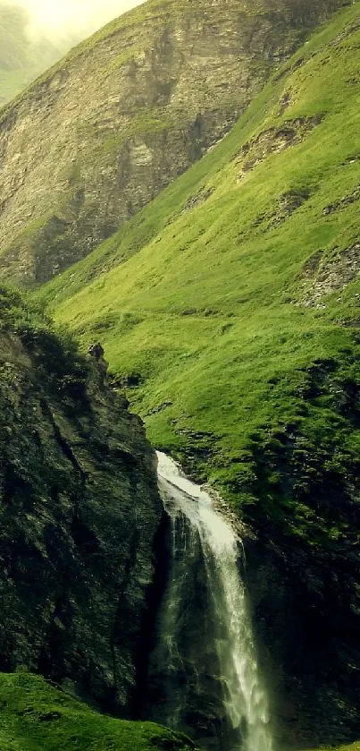 Green mountain landscape with waterfall cascade.